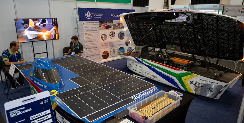 A picture of stands at a previous manufacturing Indaba showing new solutions such as solar panels