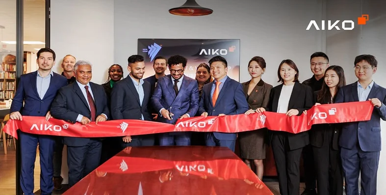 Members of the AIKO and Veers group cutting red tape