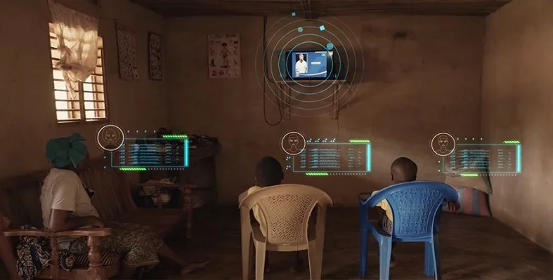 A family watching tv with digital graphics emerging from it . 