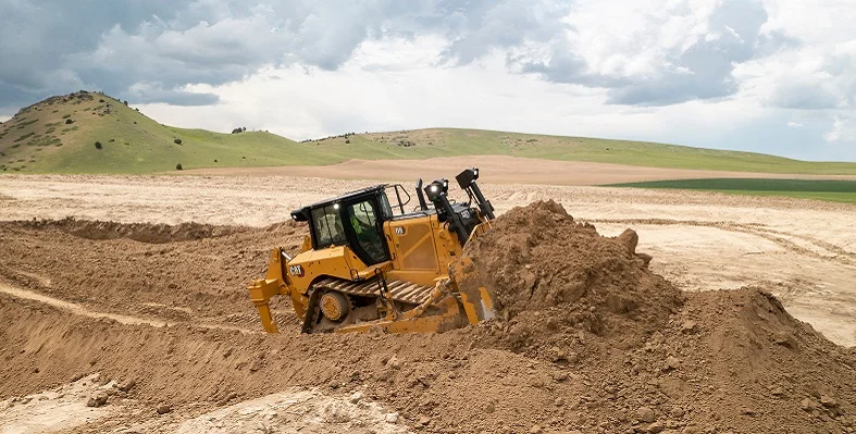 The Cat D8 dozer pushing up ground. 