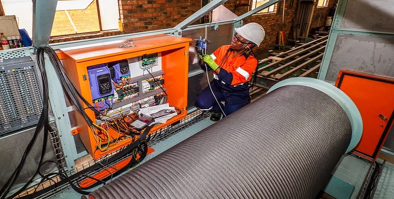 An engineer checking the electrics on a Condra hoist 