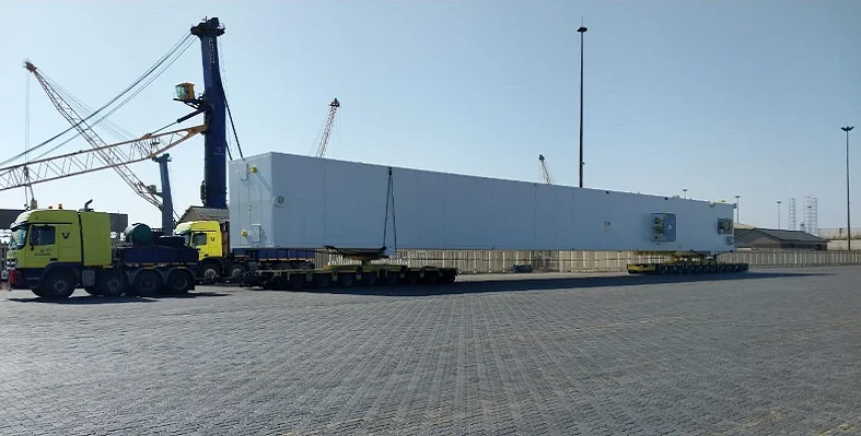 A picture of the 50-m long cold box loaded onto the trailers. 