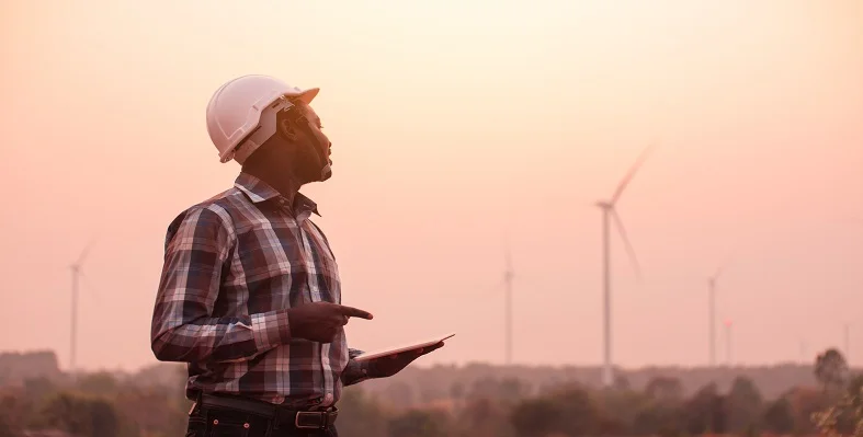 An_industrial_engineering_surveying_a_wind_farm