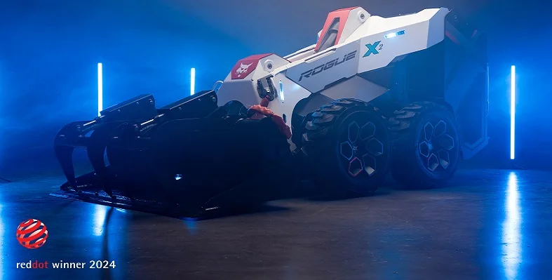 The RogueX2 loader concept in a dark studio with blue lights in the background.