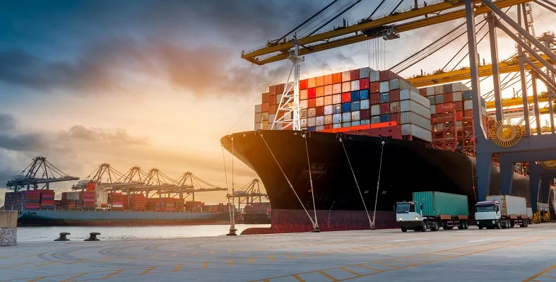 A container port terminal with a ship being loaded.