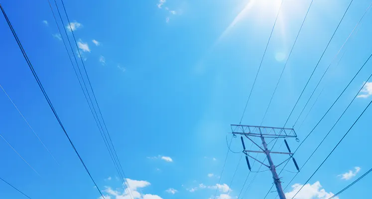Electricity_pylons_skyscape_clouds