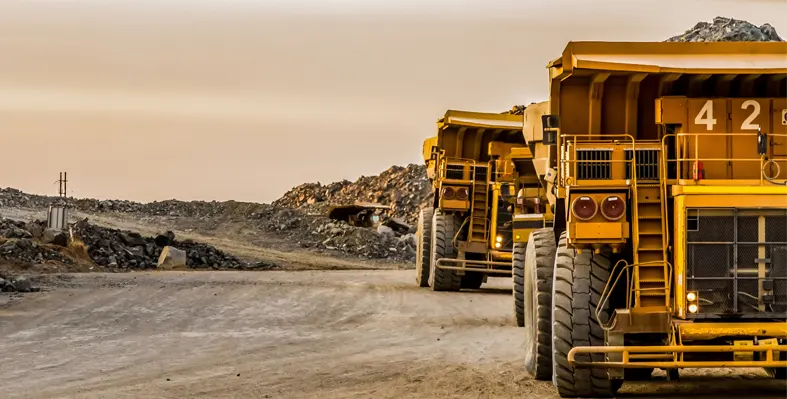 Mining dump trucks transport Platinum for processing