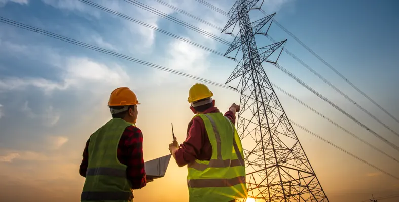 Two electrical engineers working at the station 