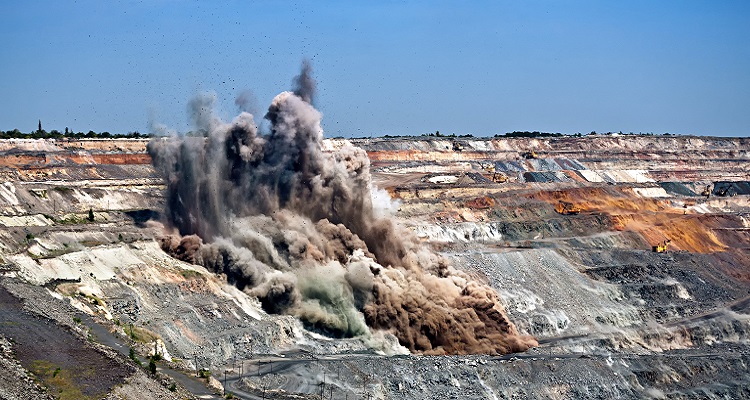 A controlled explosion taking place at a mine. 