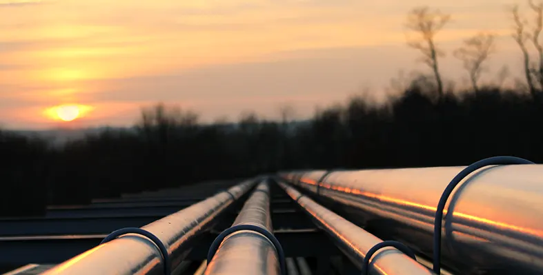 Pipelines going in the background at sunset.