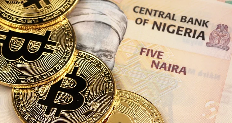 Bitcoin_coins_on_top_of_a_Nigerian_currency_note. 