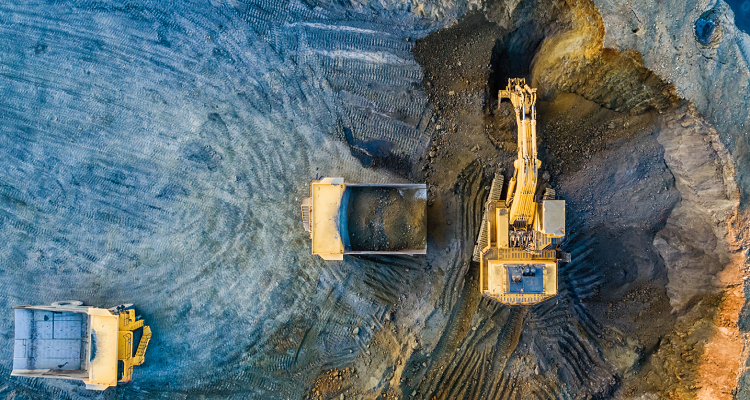 An overhead shot of mining machinery at work on site. 