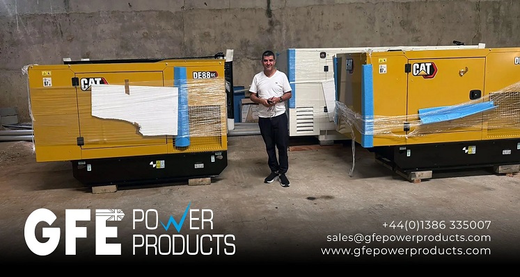 The customer of GFE surrounded by unwrapped diesel generators.