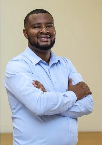 A headshot of Julien Karambua.