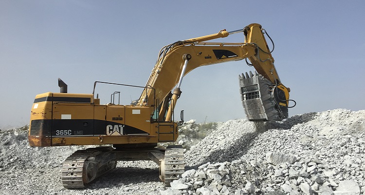 An MB Crusher crusher bucket on a Cat excavator.