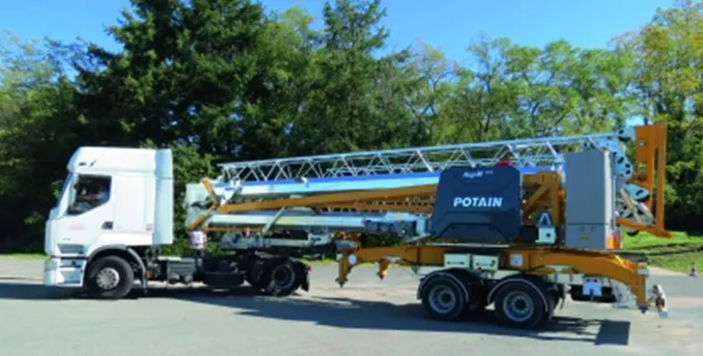 Manitowoc's_Potain_crane_on_the_road