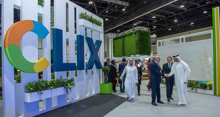 Attendees at a previous WFES around a CLIX banner. 
