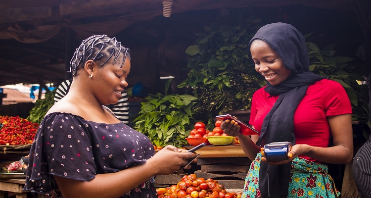 Customers of Access Africa will be able to make simple international payments through the new partnership African_women_buying_vegetables