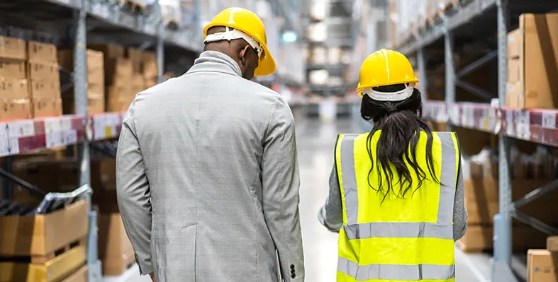 This partnership with Afreximbank offers a unique opportunity for Libya to expand its trade ties across the continent and drive economic growth. (Image source: Adobe Stock) Two engineers managing international logistics.