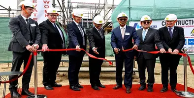 The leaders of the organisations cutting the red tape for the new plant.