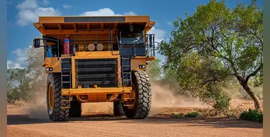 mining-truck-driving-on-dirt-road
