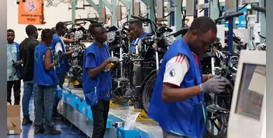 Mechanics-blue-vests-working-Spiro-motorcycles