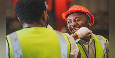 African-factory-workers-yellow-vests-red-hardhats