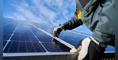 Solar_panel_technician_at_work