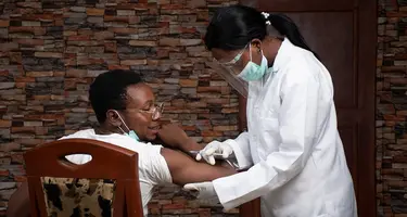 A vaccine being administered to a patient. 