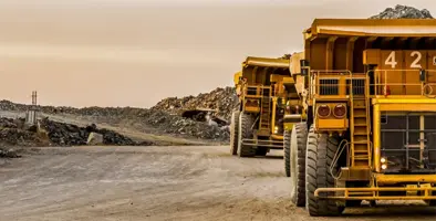 Mining dump trucks transport Platinum for processing