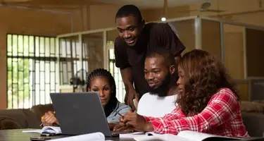 Employees_working_happily_on_a_laptop