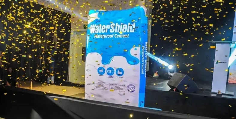 The unveiling of the WaterShield Cement with confetti falling around it.