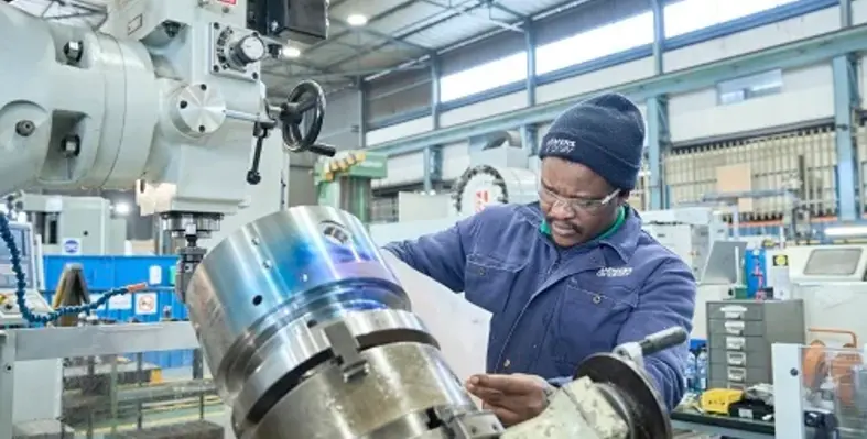 A Siemens Energy worker attending to a piece of equipment. 