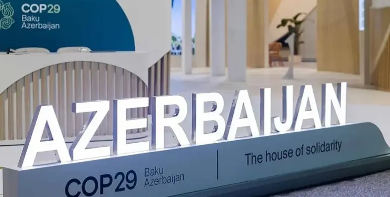A sign for COP29 with Azerbaijan in big letters.