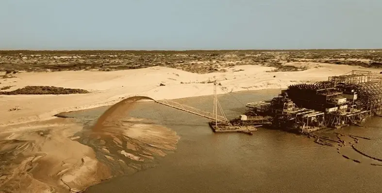 A mineral sands producing mine pouring sand into a pile