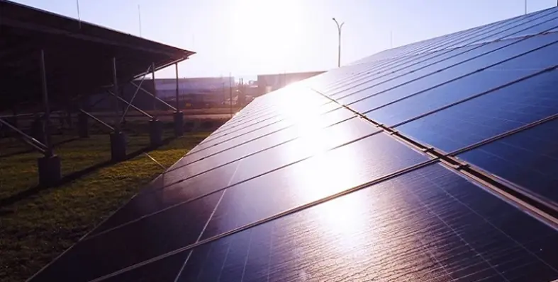 Light reflecting off of a panel at a solar farm.