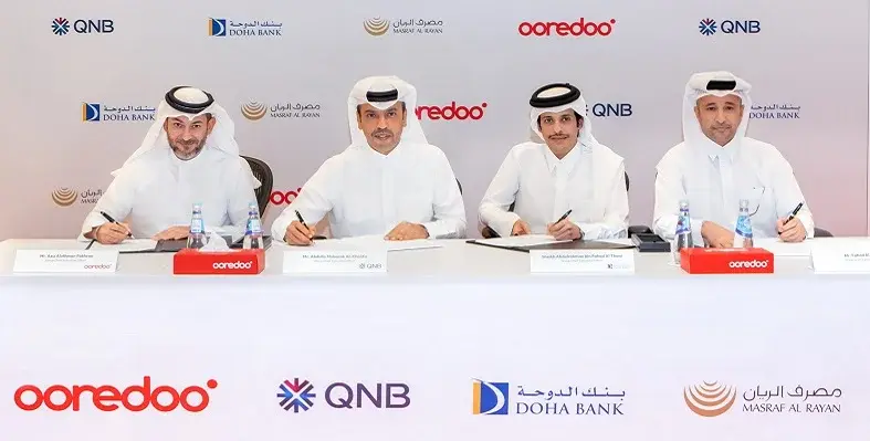 The signing ceremony with leaders of each organisation.