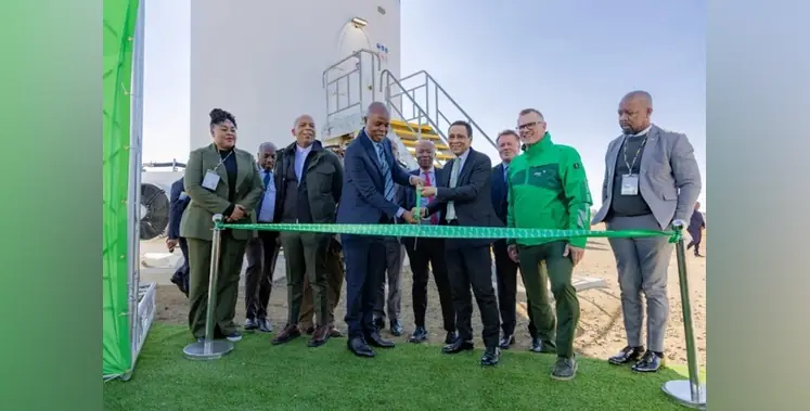 Crowd-businesspeople-cut-green-tape-opening-ceremony