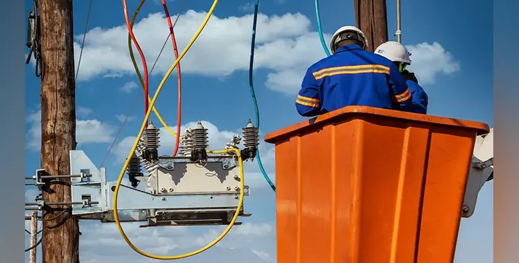 African-engineer-working-electricity-pylon