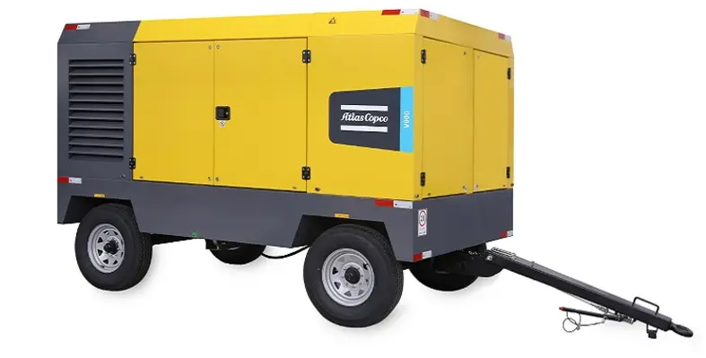 An Atlas Copco V900 mobile compressor against a white background. 