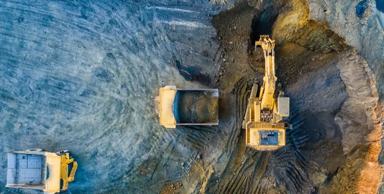 An overhead shot of mining machinery at work on site. 