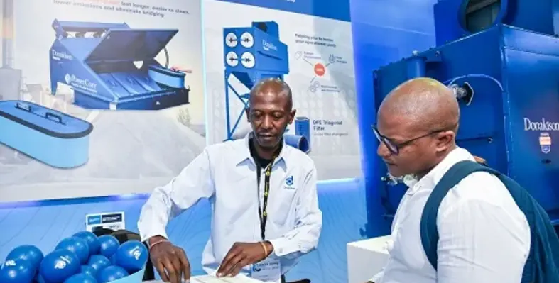 An exhibitor speaking to a visitor at a previous edition of Electra Mining