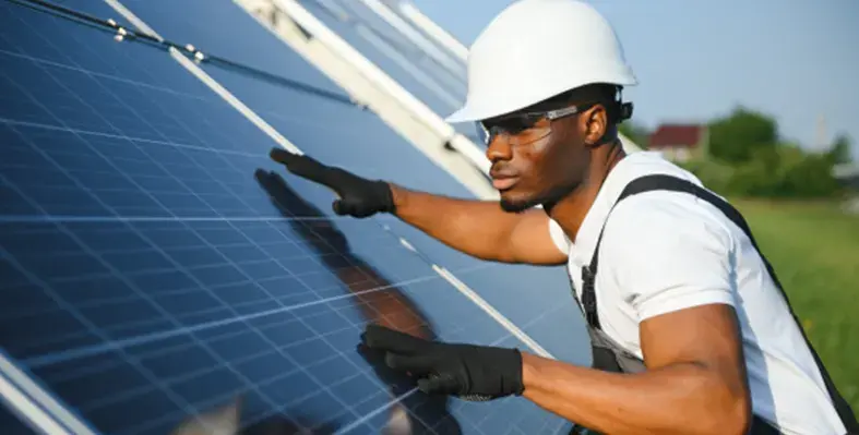 Man_trying_to_fix_the_solar_panel