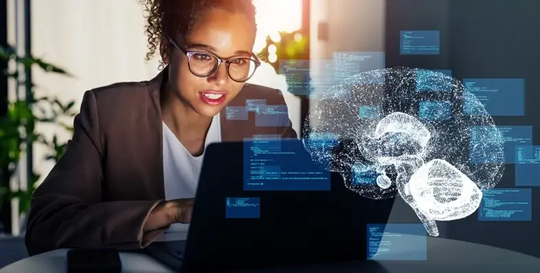 An employee working on a laptop with an AI digital image imposed over the front. 