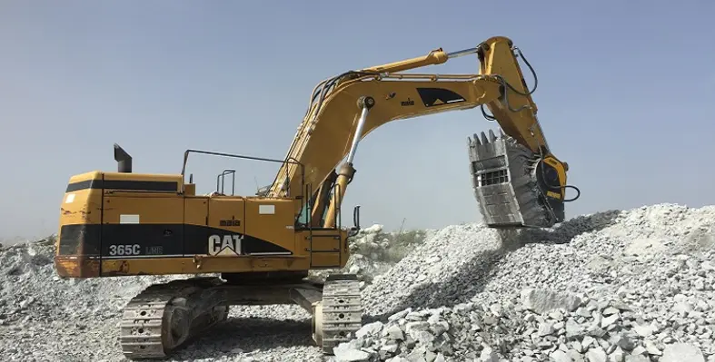 An MB Crusher crusher bucket on a Cat excavator.