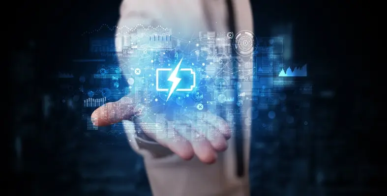 A person holding a digitally-rendered electric battery in the palm of their hand.