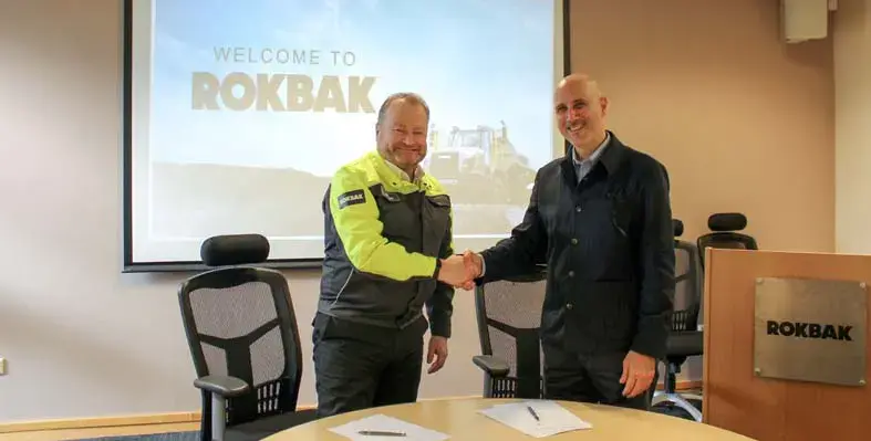 Rokbak managing director, Paul Douglas, and HMD CEO, Mathew Khouri. (Image source: Rokbak) Rokbak managing director, Paul Douglas, and HMD CEO, Mathew Khouri, shaking hands.