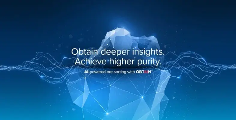 Tomra unveiled the new Deep Learning solution at Investing in African Mining Indaba. (Image source: TOMRA) TOMRA Mining OBTAIN digital marketing poster. Reads: Obtain deeper insights. Achieve higher purity. AI-powered ore sorting with OBTAIN.