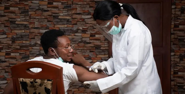 A vaccine being administered to a patient. 