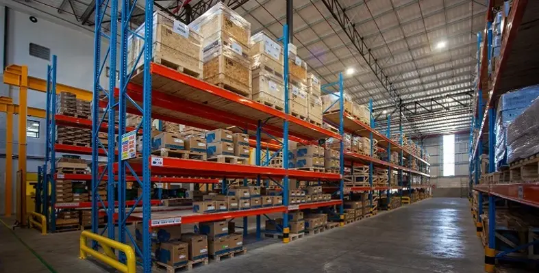 Inside WEG Africa's new facilities in Cape Town with stock piled on large shelves.